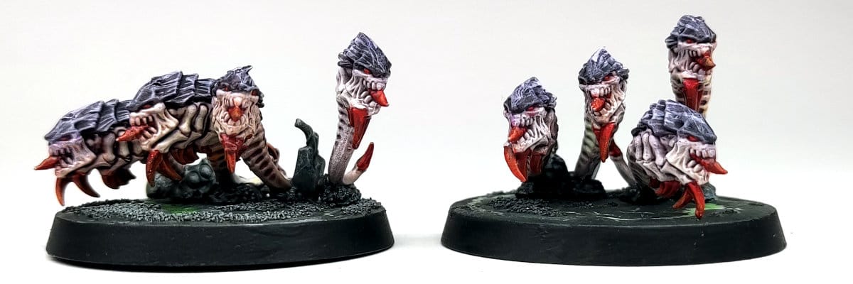 two Tyranid Ripper Swarms painted in traditional Hivefleet Leviathan colours of purple, white and red