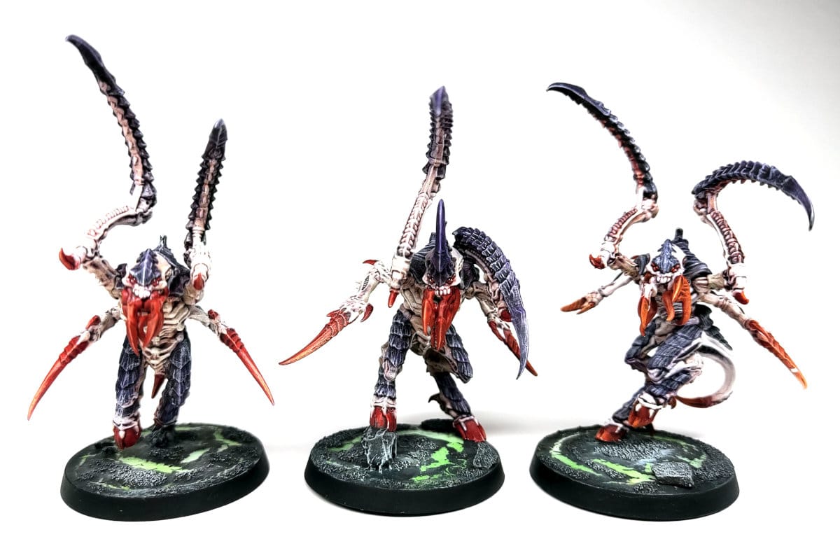 three Tyranid Von Ryan's Leapers painted in traditional Hivefleet Leviathan colours of purple, white and red